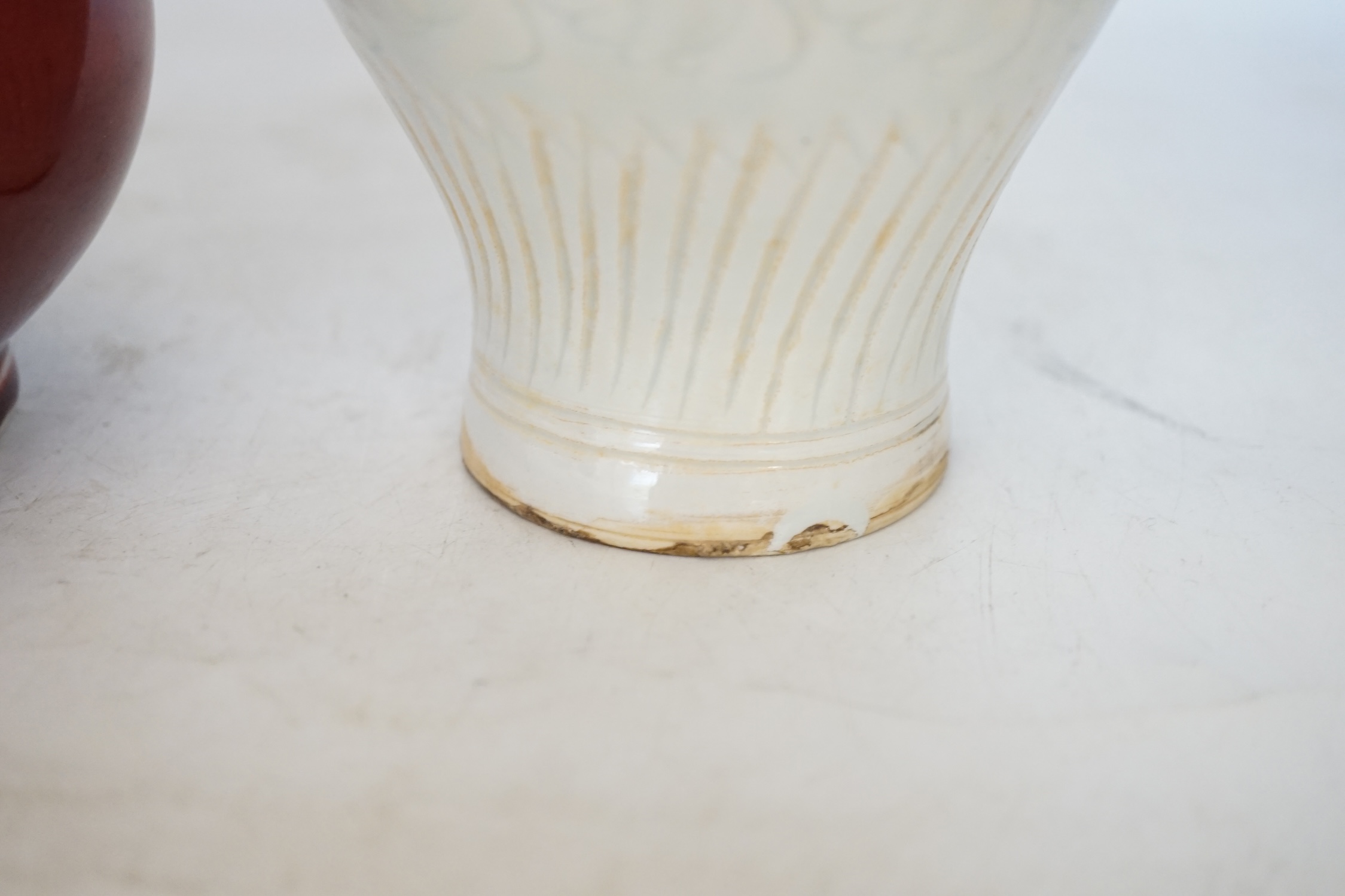 Two Chinese vases including a sang de boeuf example, largest 25cm high. Condition - larger example good, other with crazing
